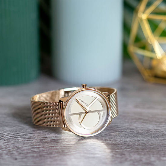 Indulge in timeless elegance with the Calvin Klein Unisex Iconic Round Gold Watches, boasting mineral glass, a dazzling gold dial in a classic round shape, and a 50 to 60% discount for a touch of luxury at 36mm dial diameter.