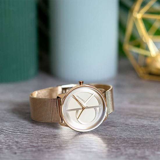 Indulge in timeless elegance with the Calvin Klein Unisex Iconic Round Gold Watches, boasting mineral glass, a dazzling gold dial in a classic round shape, and a 50 to 60% discount for a touch of luxury at 36mm dial diameter.